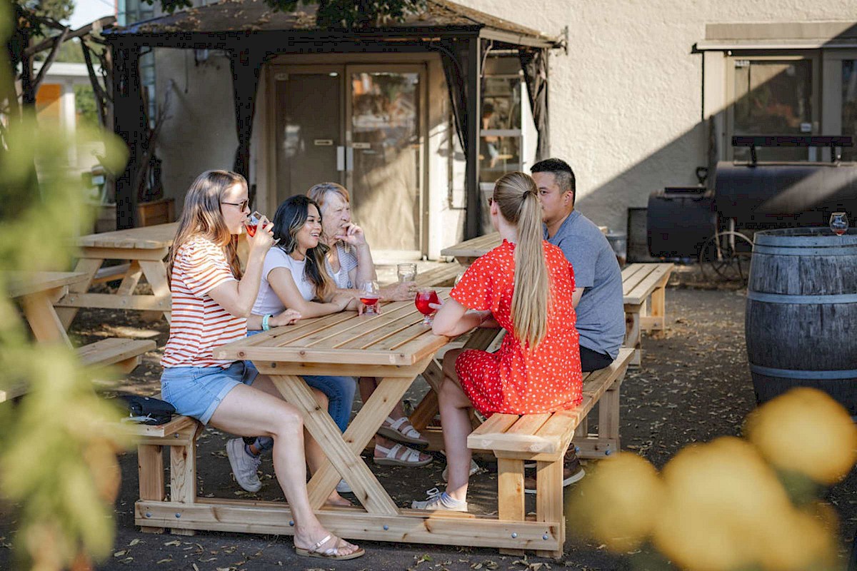 People sitting on the patio at a brewery